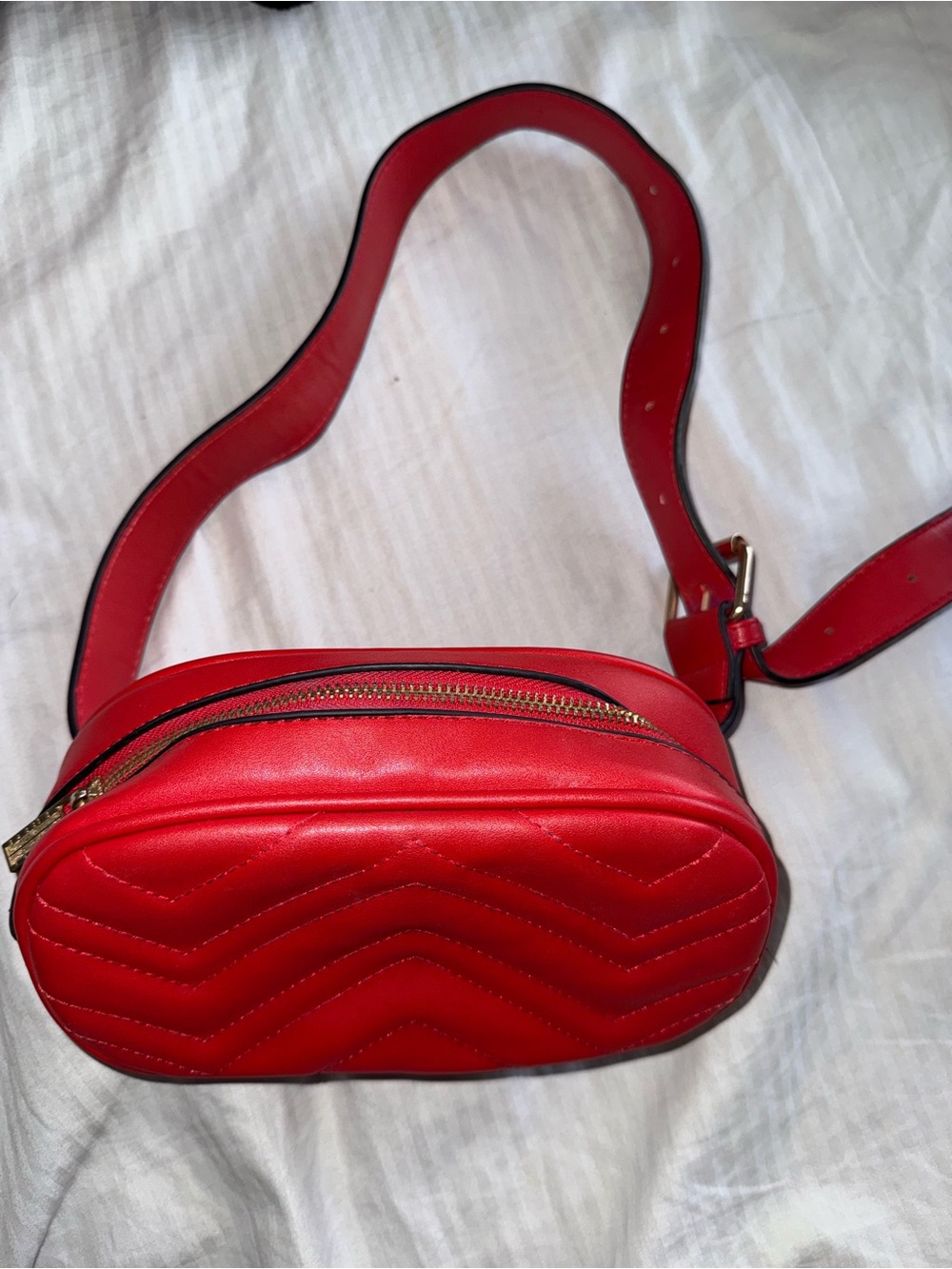 Red leather Fanny pack bag with adjustable strap.